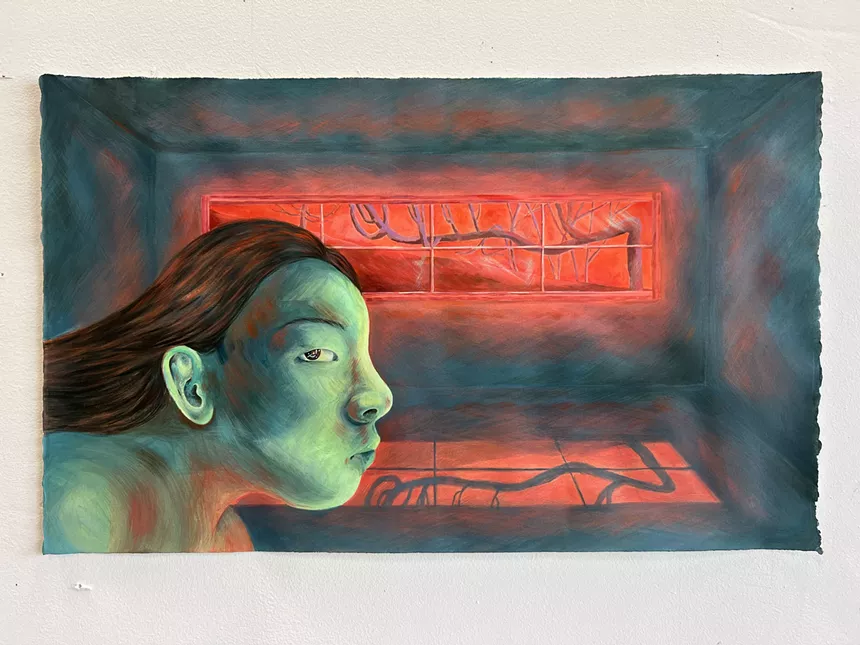 artwork of a women's green face with a red background