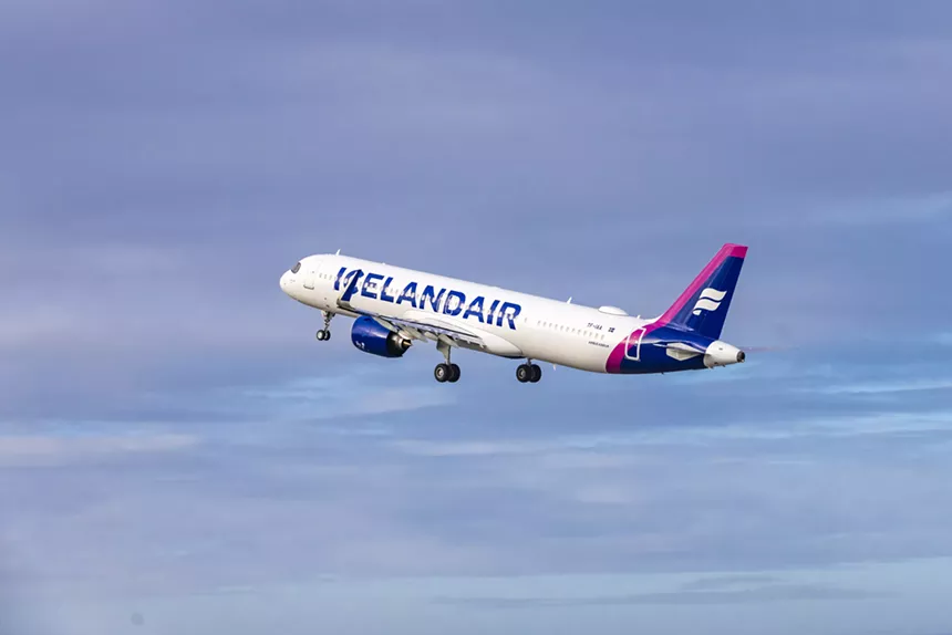 Icelandair plane flying through blue skies