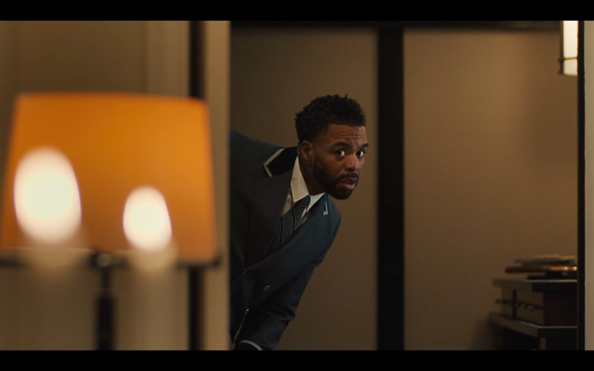 film still of Cliff "Method Man" Smith peeking through a door frame