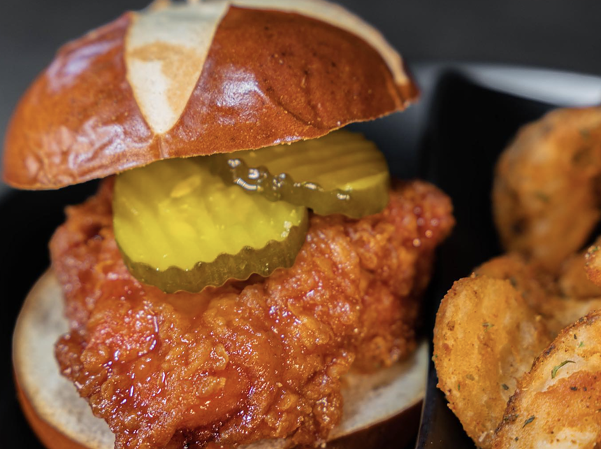 fried chicken sandwich with a pickle