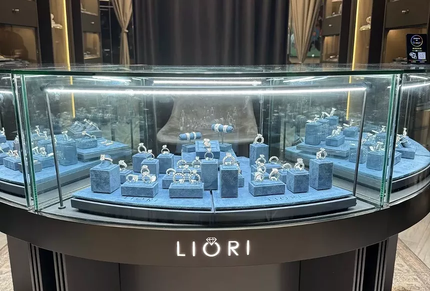 a jewelry display behind a glass case