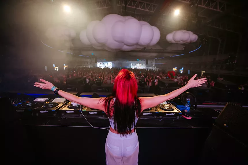 Pretty Pink performing on stage in front of a crowd