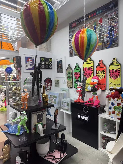 Art sculptures and wall art inside Miami Fine Art Gallery Gift Shop