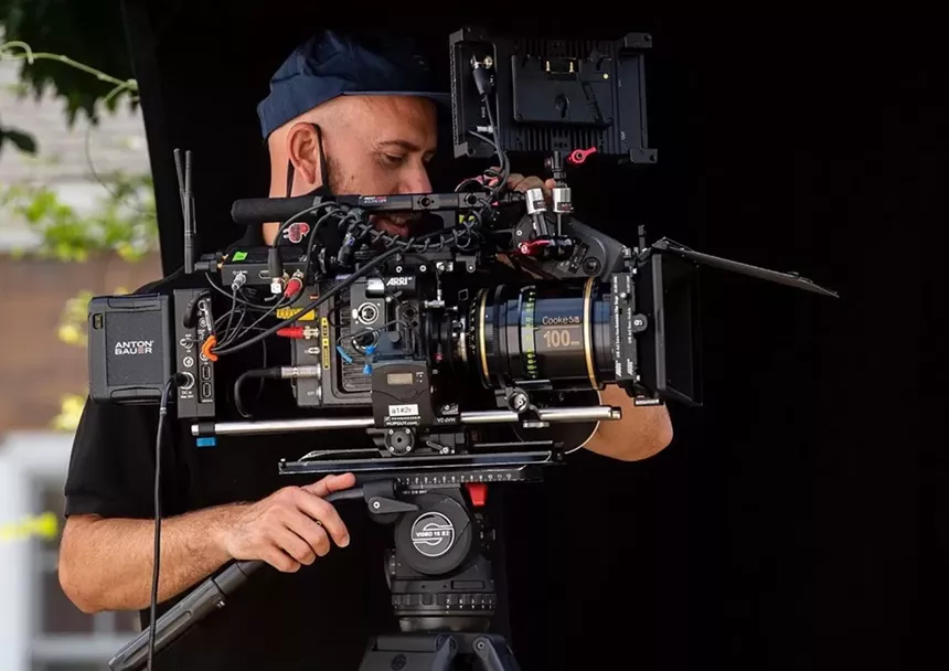 Man holding a professional video camera