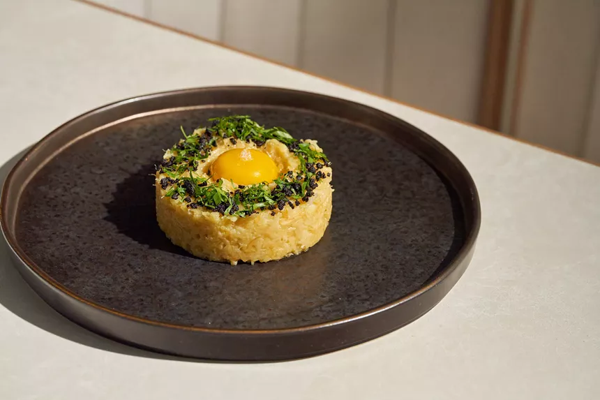 an egg dish on a black plate