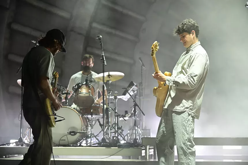 a band performing on an amphitheater stage