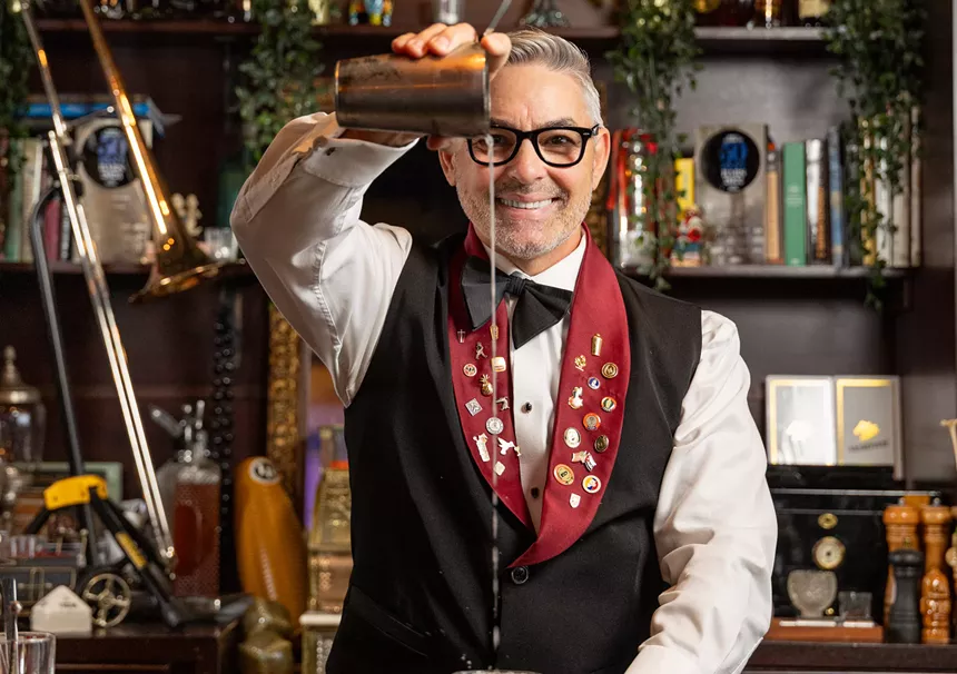 bartender pouring a cocktail
