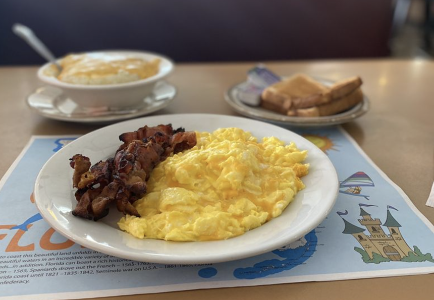 Eggs with bacon on plate