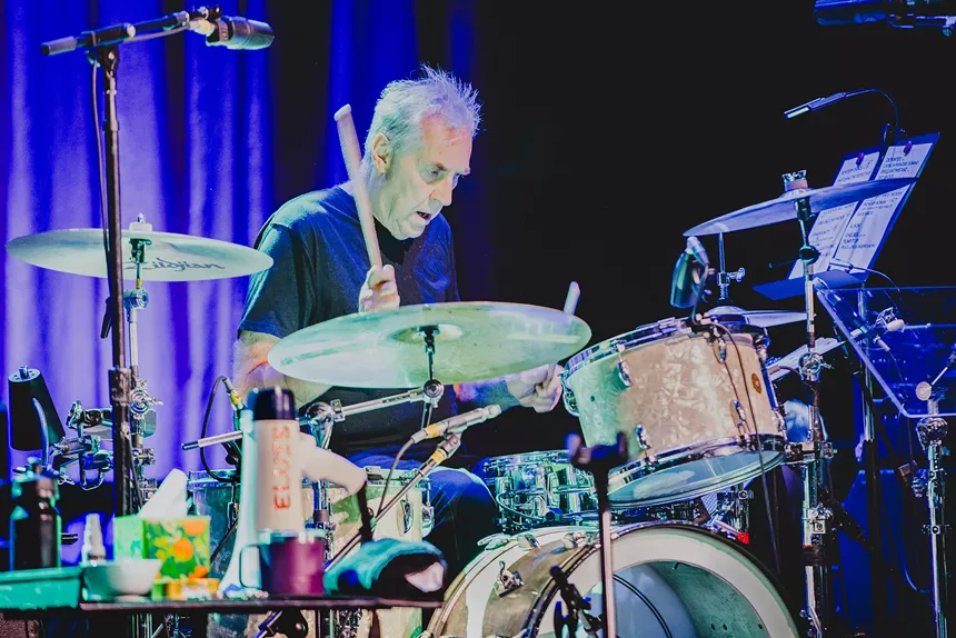Drummer Pete Thomas performing live.
