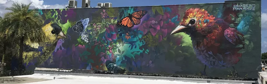a floral mural depicts birds made of flowers
