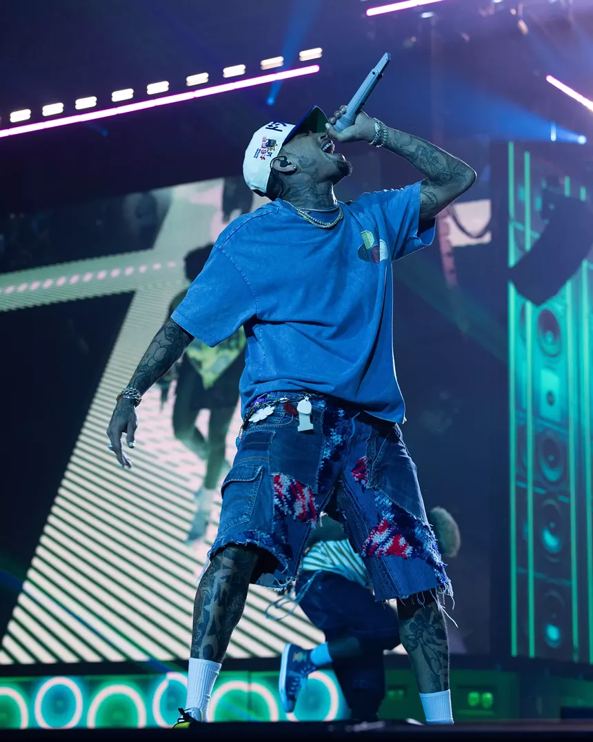A man singing on stage.