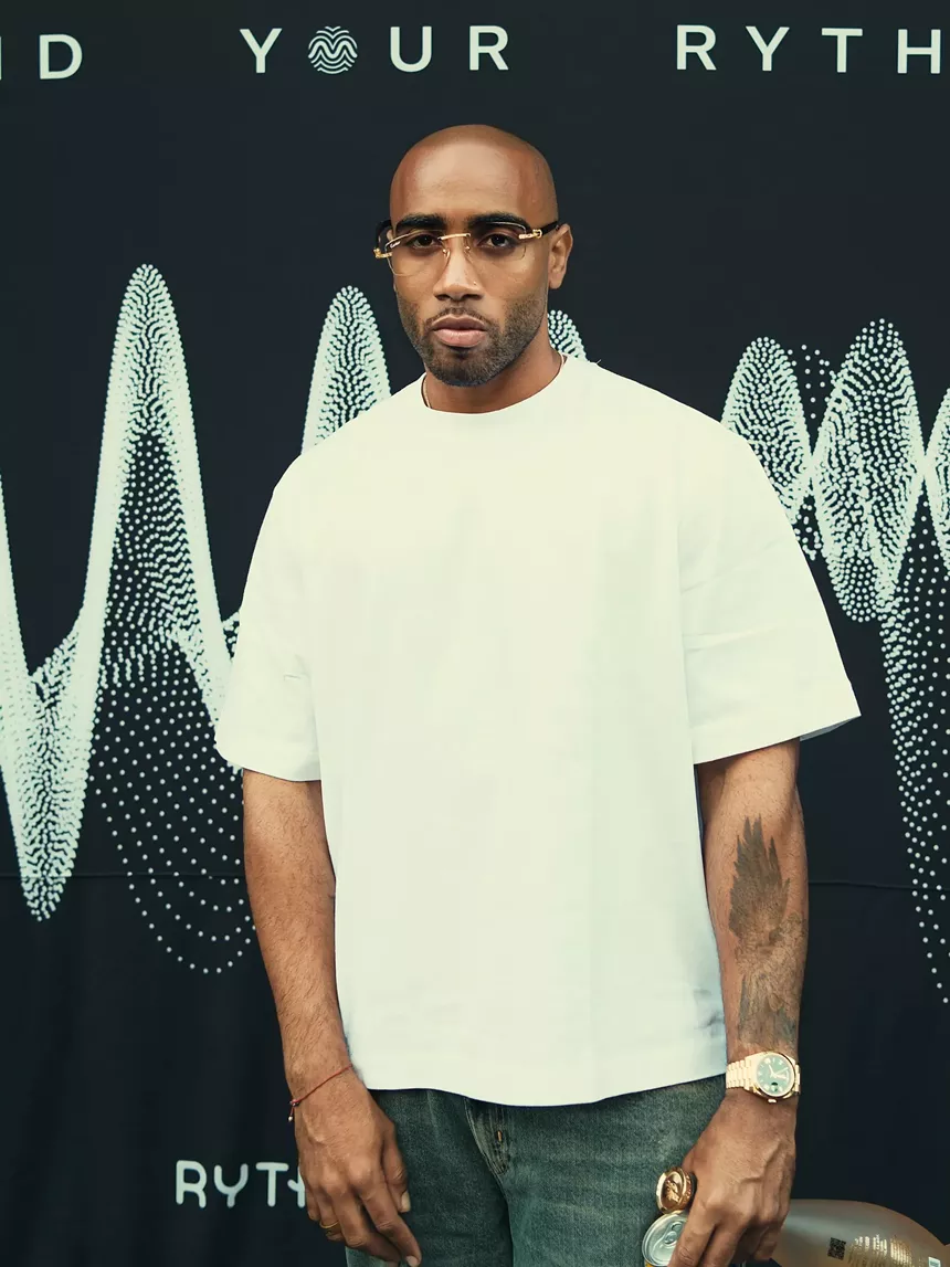 Portrait of a man wearing glasses and a white shirt
