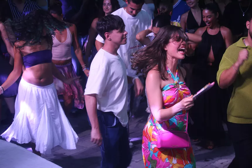 People dancing to Latin music.