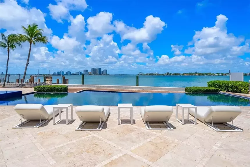 A resort-style backyard pool is pictured overlooking Biscayne Bay.