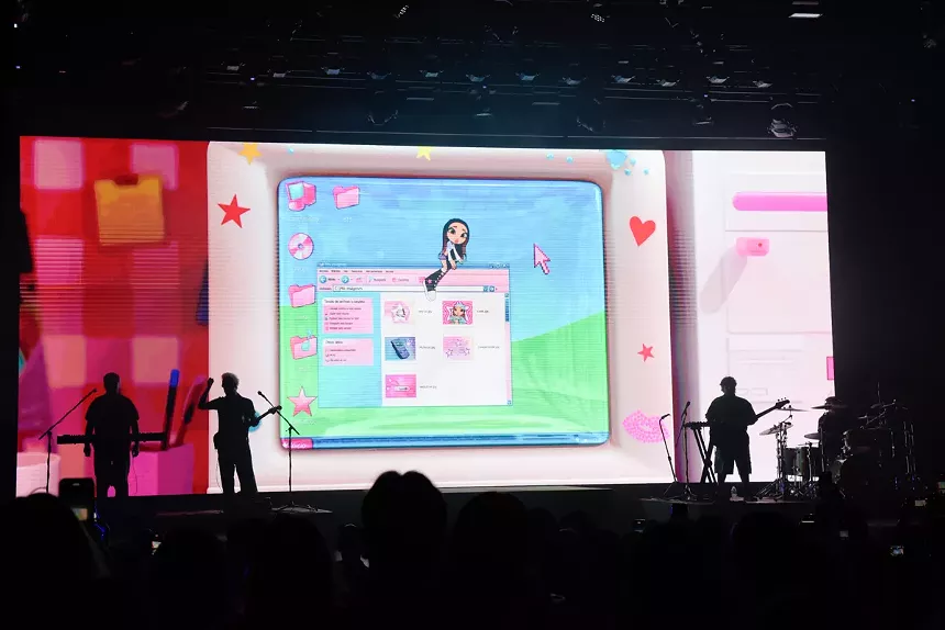 a stage with a backdrop that looks like a computer's desktop.