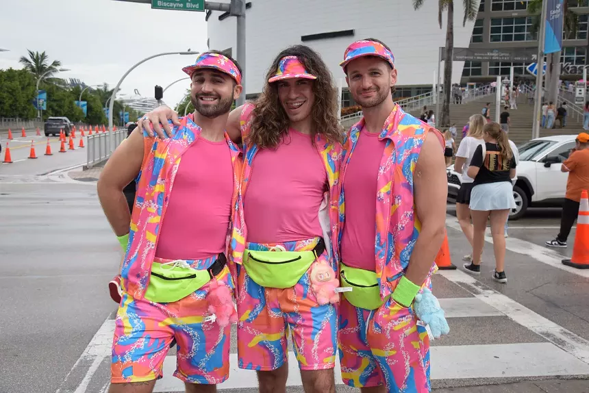 A picture of three Katy Perry fans outside the Kaseya Center in Miami.
