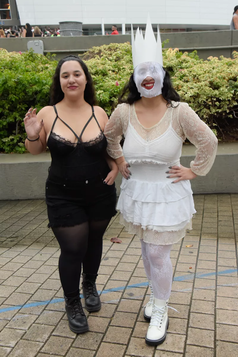 Two Lady Gaga fans posing outside the Kaseya Center.