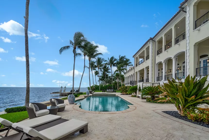 The backyard and pool overlooking the water.