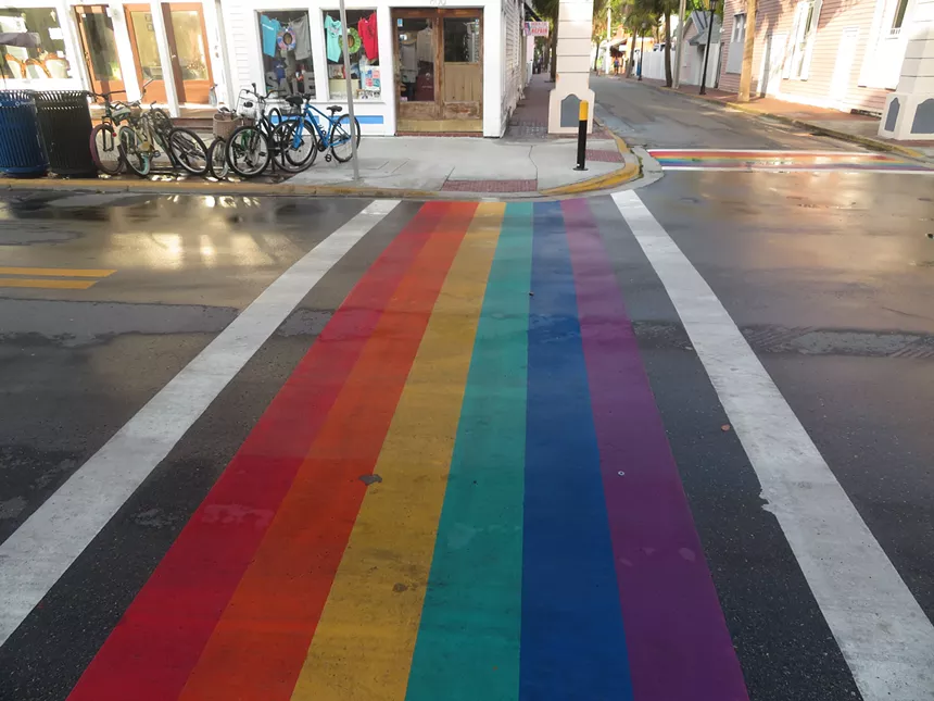 Depicted is a rainbow crosswalk across Duval Street in Key West.