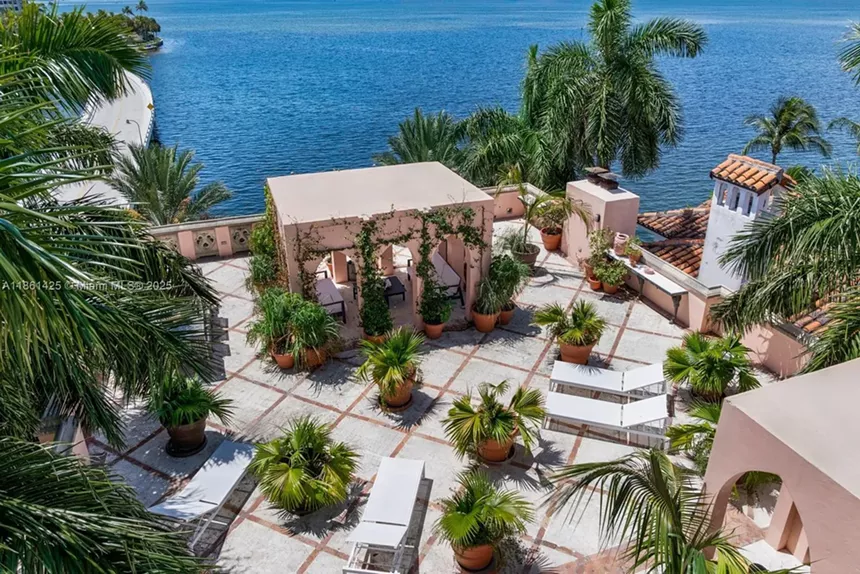 Depicted is a courtyard overlooking Biscayne Bay.