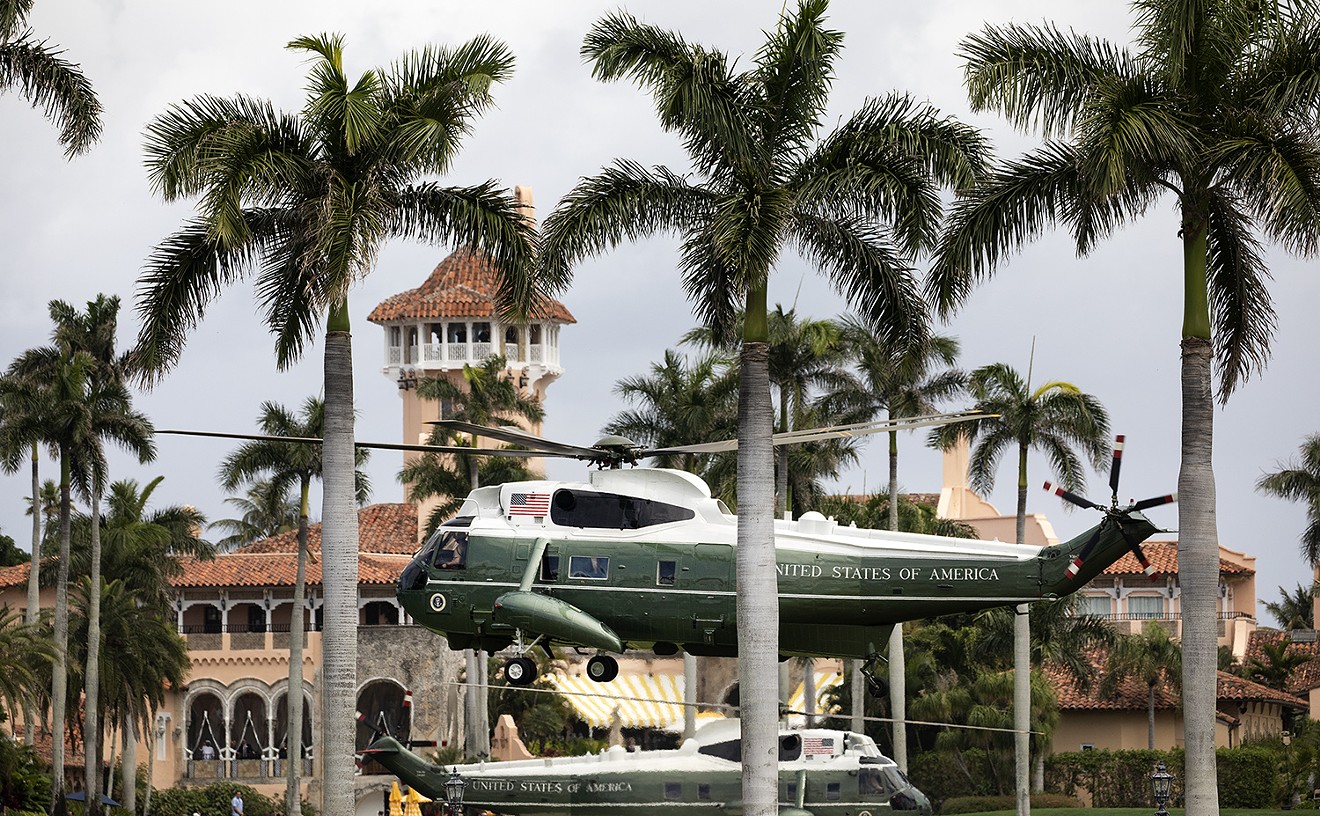 Then-President Donald Trump aboard Marine One lands back at Mar-a-Lago as an escort helicopter hovers Friday, March 29, 2019.