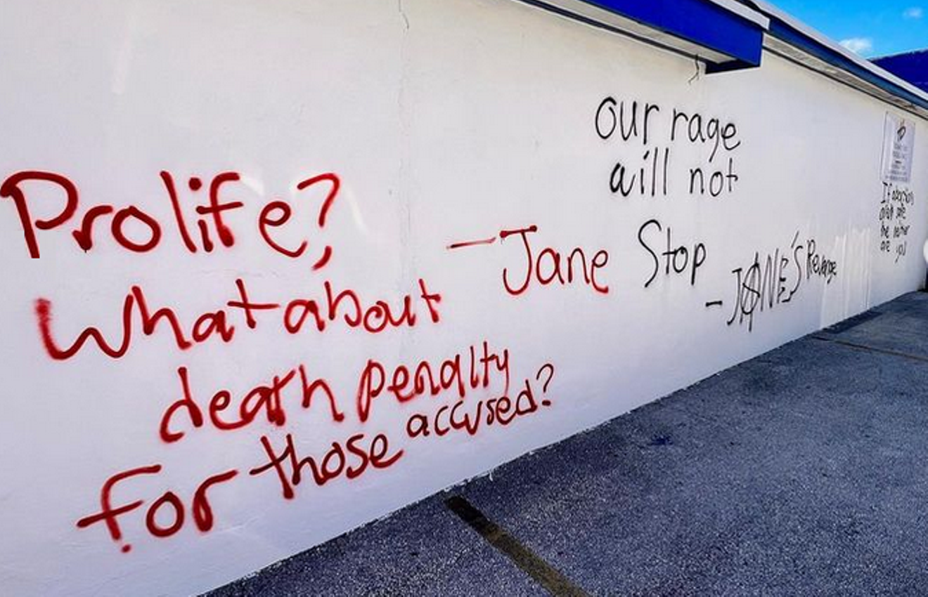 Federal prosecutors have charged two defendants with felonies for allegedly defacing the side of a Hialeah anti-abortion counseling center.