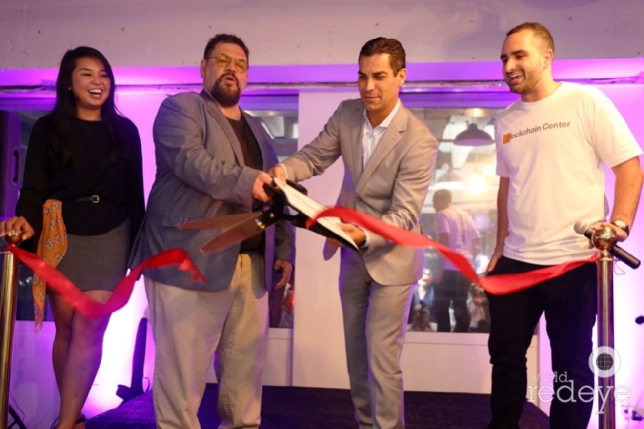 Miami Mayor Francis Suarez carries out the ribbon cutting ceremony for Eryka Gemma Flores' Miami Blockchain Center on June 14, 2019.
