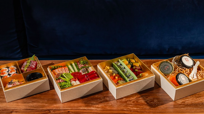sushi boxes on wood table
