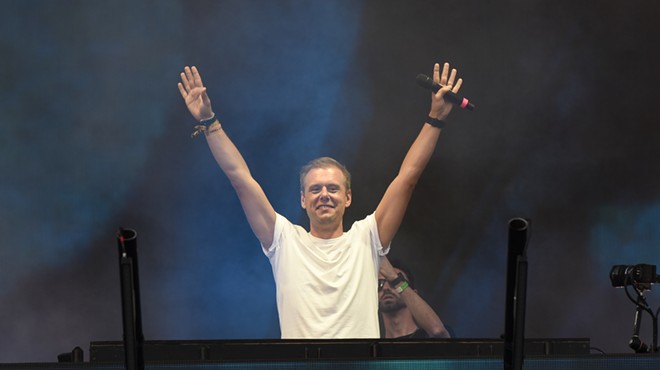 DJ Armin van Buuren with his hands raised up at Ultra Music Festival in Miami