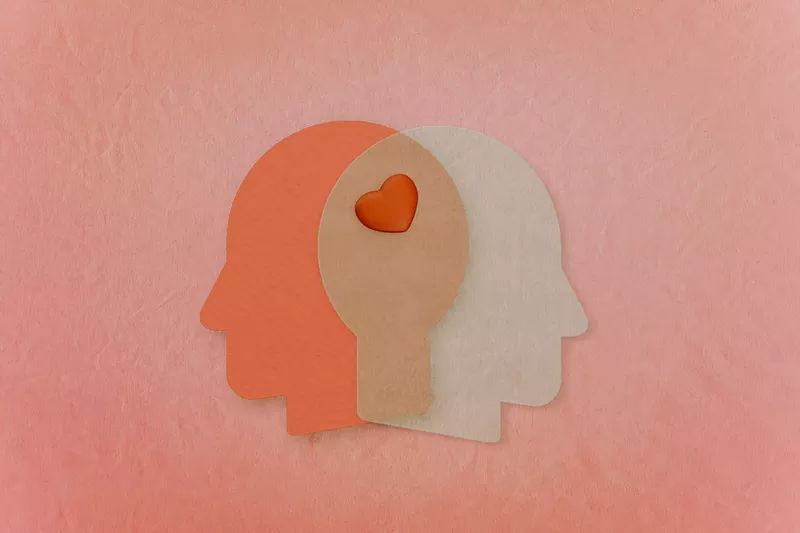 Image: An illustration of two heads sharing a heart