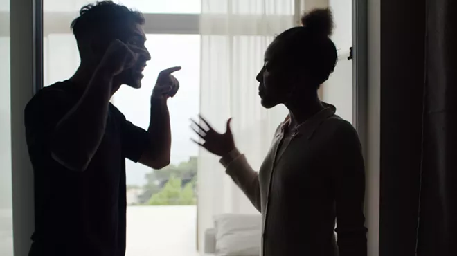Silhouette of a couple arguing