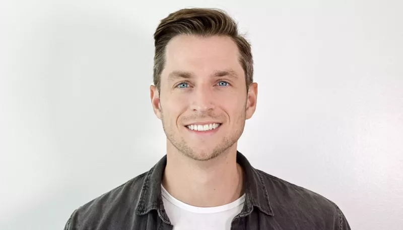 Image: a portrait of a man in front of a white background