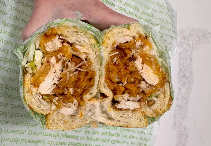 Image: Our honest review of Publix's new "Peach Heat Chicken Tender" Pub Sub with chicken tenders, chipotle gouda, coleslaw, and jalapeños.