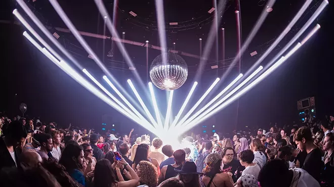 laser lights, a disco ball, and a crowd