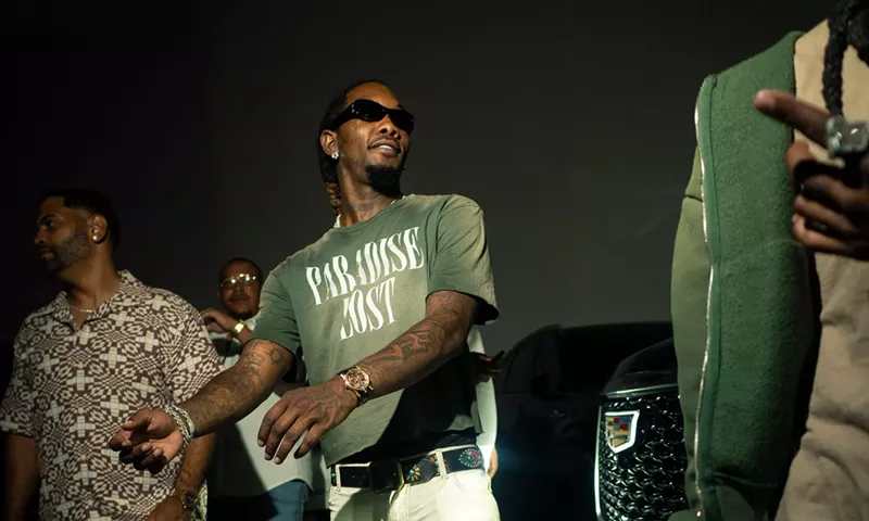 Image: Picture of rapper Offset getting out of a car.