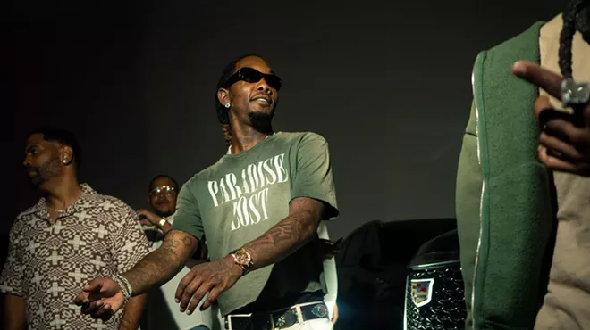 Picture of rapper Offset getting out of a car.