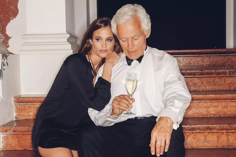 Image: Younger woman embracing a much older man