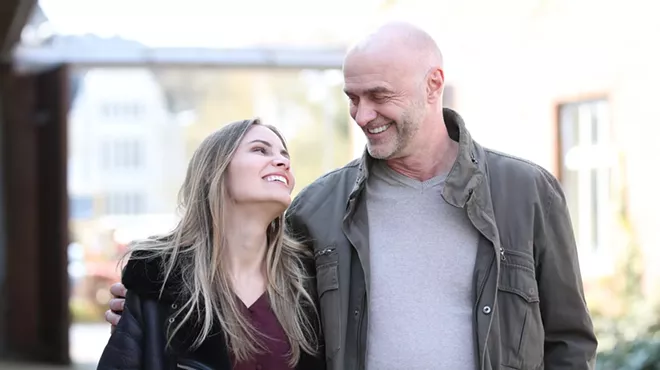 photo of a young woman gazing lovingly into the eyes of an older man
