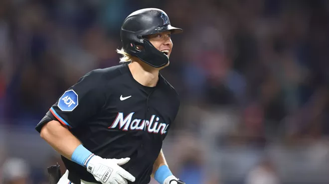Miami Marlins left fielder Kyle Stowers #28 smiles as he rounds the bases after hitting a walk-off home run at LoanDepot Park in Miami, Florida