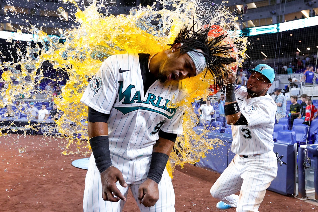 Luis Arráez of the Miami Marlins gives teammate Jean Segura a Gatorade bath after defeating the Chicago Cubs at LoanDepot Park on April 28, 2023, in Miami.