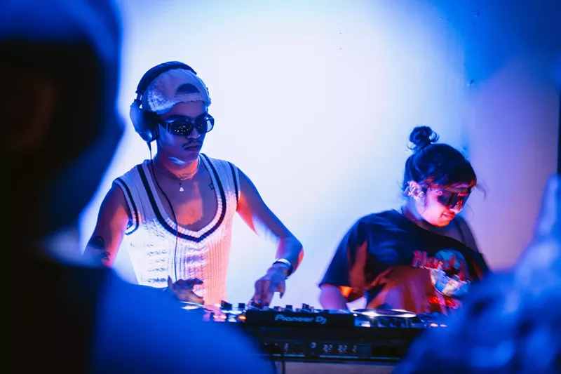 Image: two DJs at decks