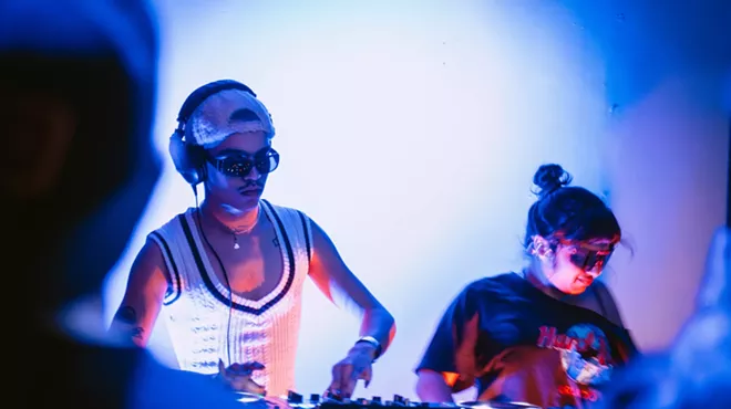 two DJs at decks