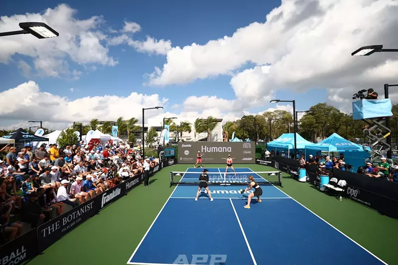 Image: spectators watch a pickleball tournament on a sunny day
