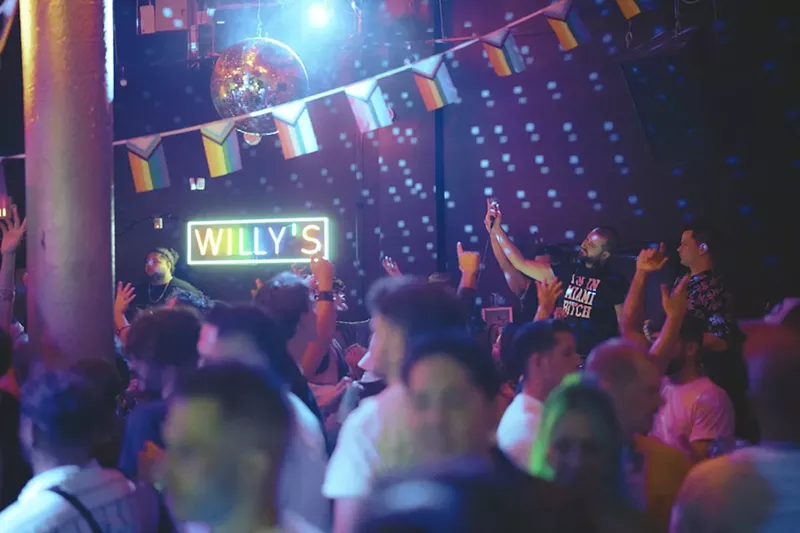 Image: People dancing inside of Willy's Neighborhood Bar in Wynwood