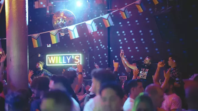 People dancing inside of Willy's Neighborhood Bar in Wynwood
