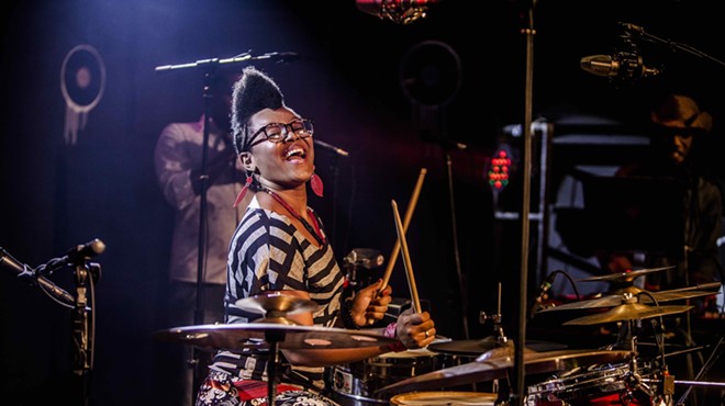 Yissy García playing the drums during a live performance