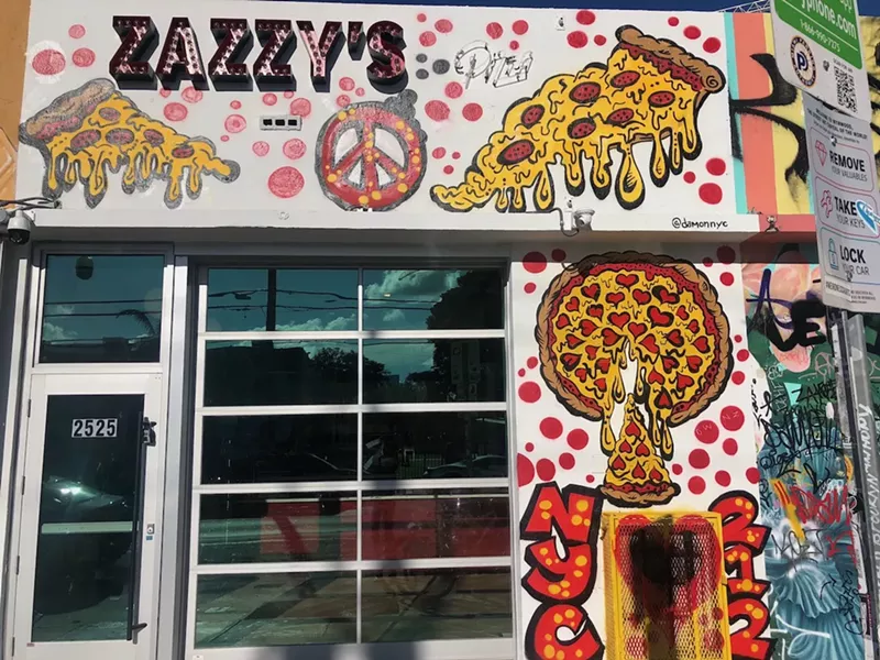 Image: The storefront of Zazzy's Pizza in Wynwood